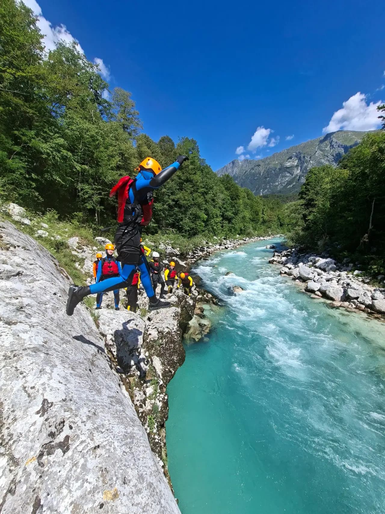 Body rafting group on the emerald Soča River